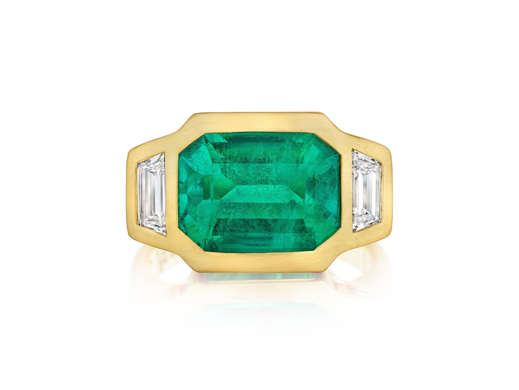 Bezel Set East-West Emerald Cut Emerald Three Stone Ring with Trapezoid Diamond Side Stones in Matte Yellow Gold