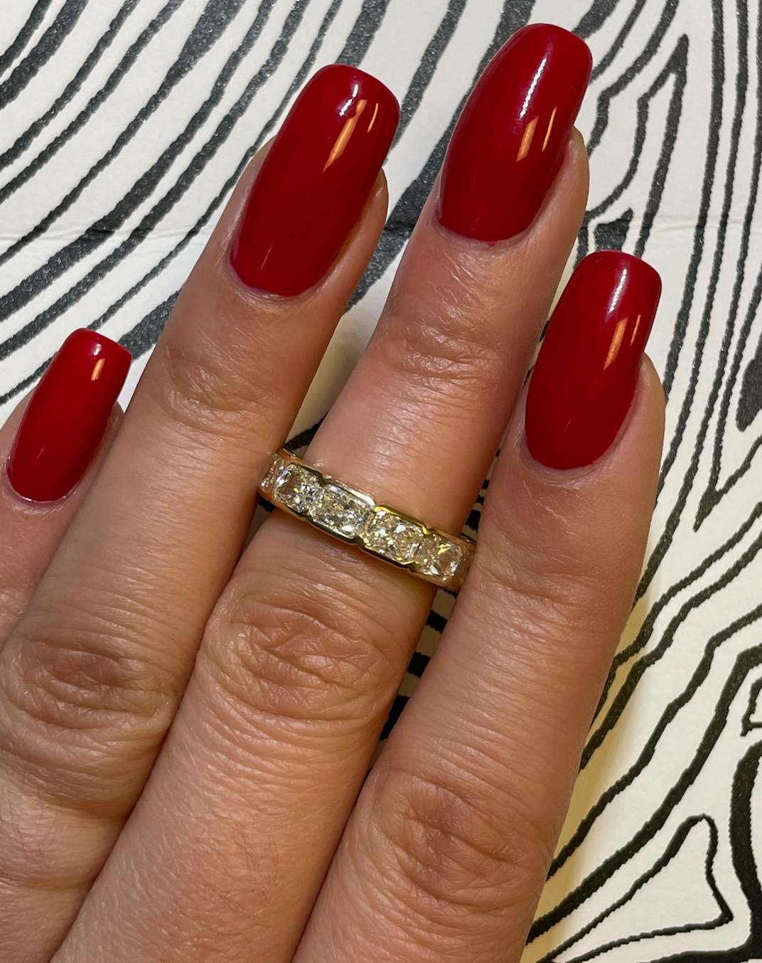 East-West Bracket Bezel Emerald Cut Diamond Half Eternity Band