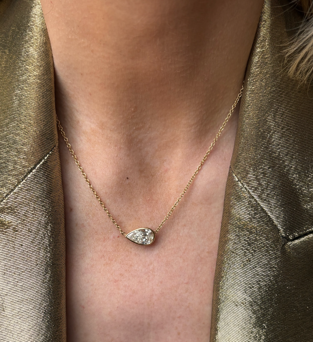 East-West Bezel Set Pear Diamond Pendant in Yellow Gold