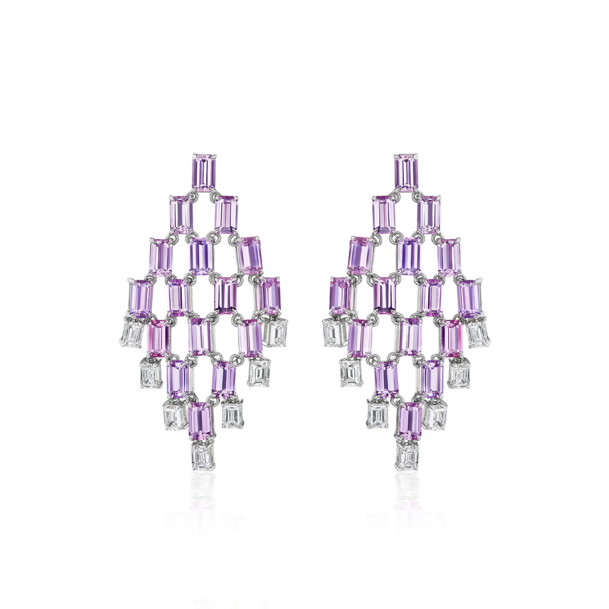 A pair of chandelier-style earrings featuring a geometric pattern of rectangular purple and clear gemstones set in a lattice design on a white background.