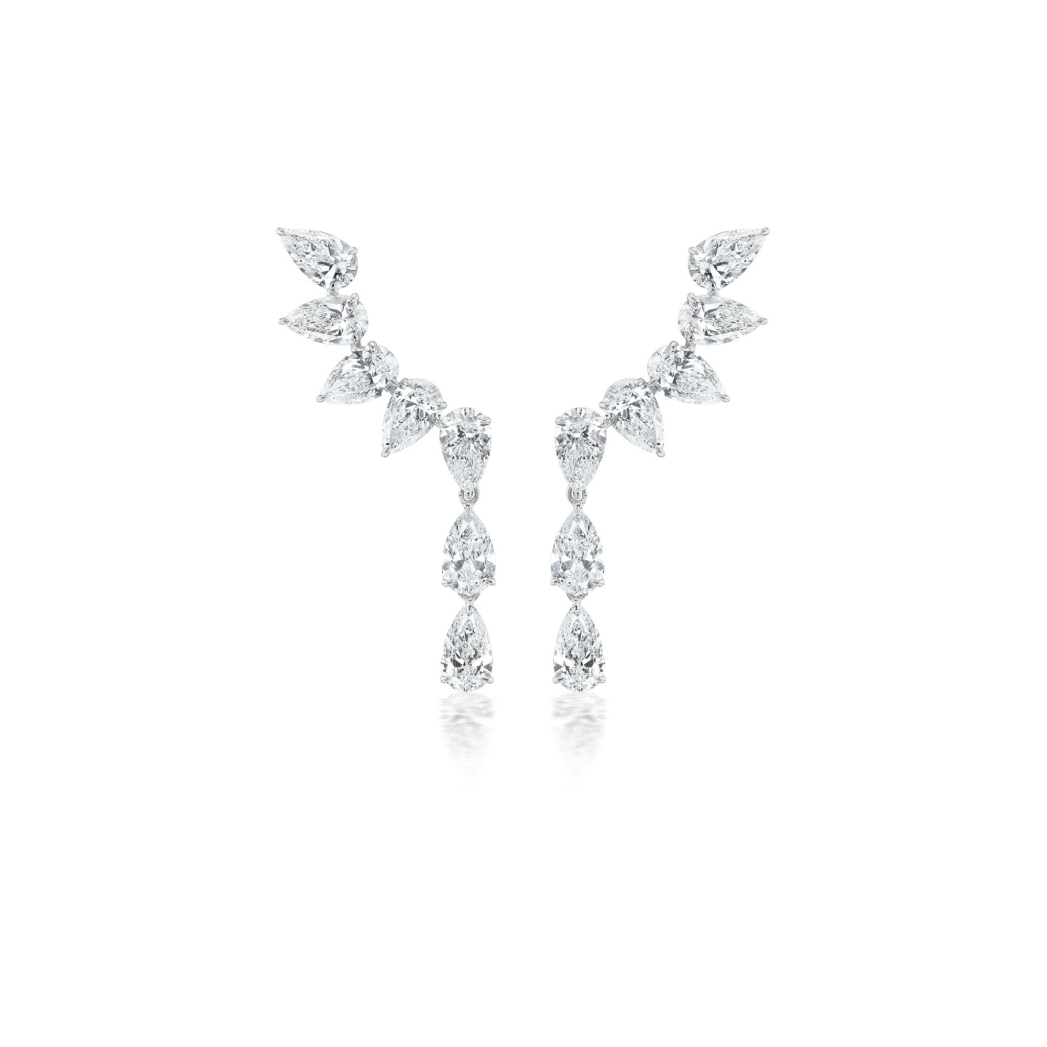 A pair of diamond earrings featuring multiple pear-shaped stones arranged in a curved, symmetrical design on a white background.