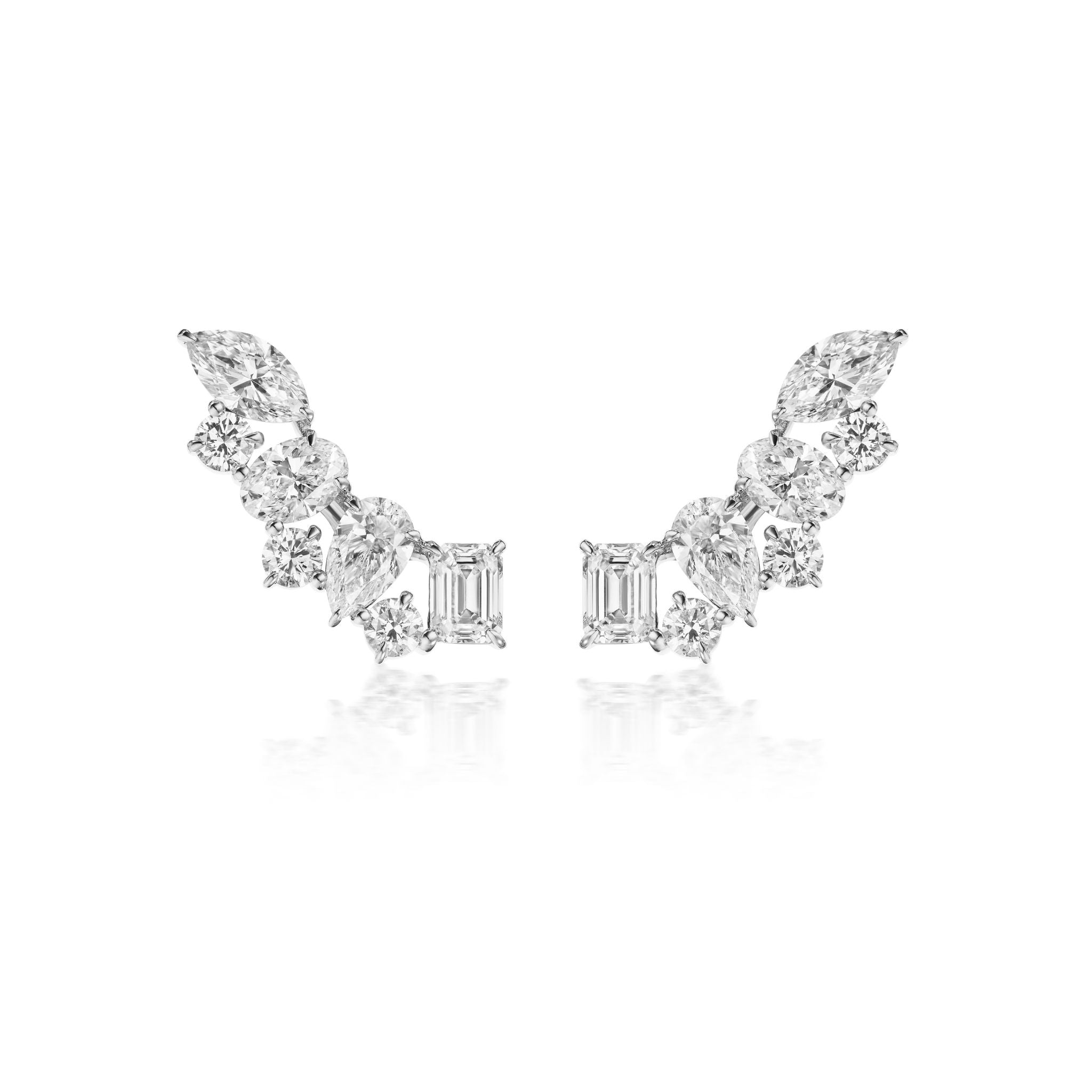 A pair of diamond earrings featuring a mix of marquise, round, and emerald-cut stones arranged in a curved, wing-like design on a white background.