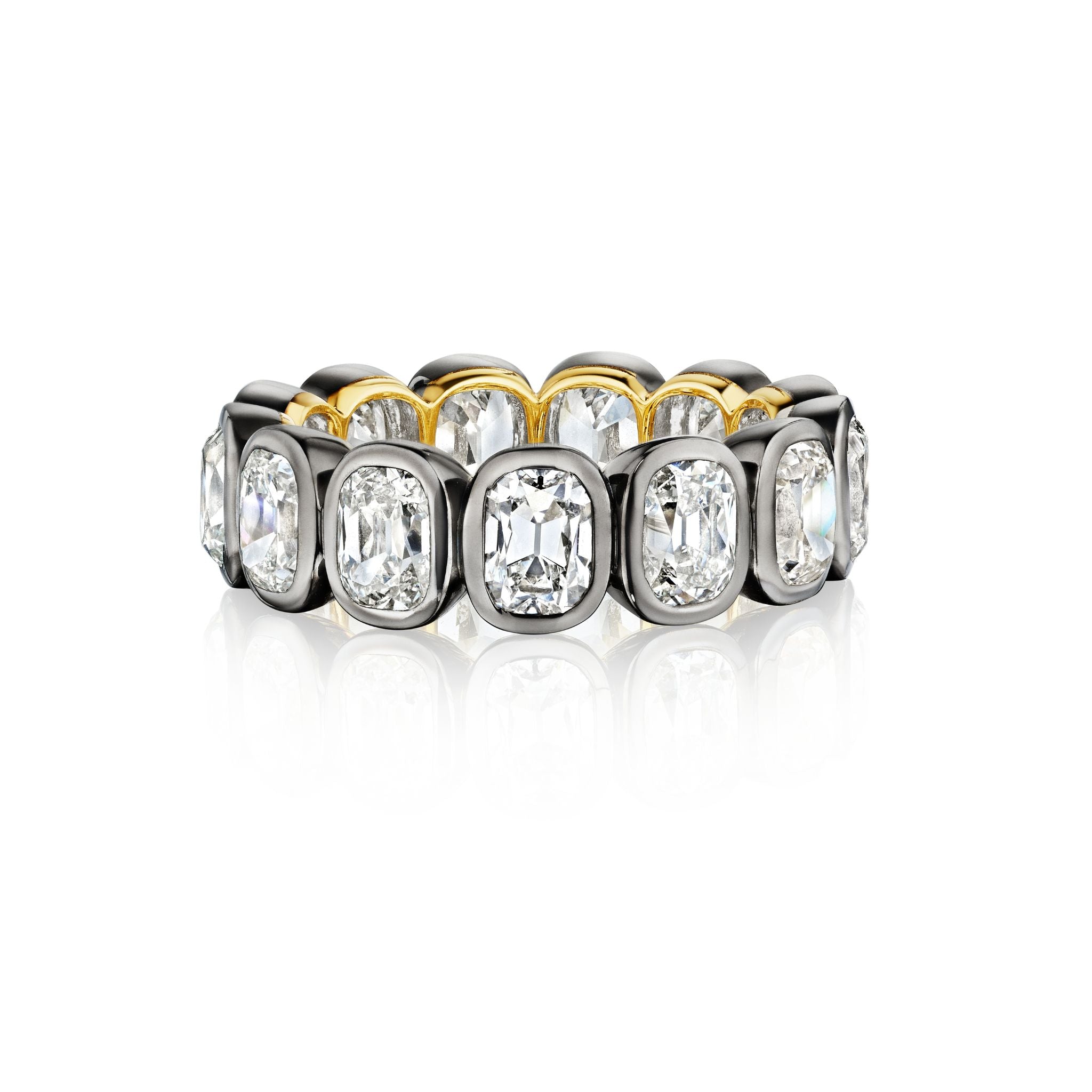 A gold and silver ring with large, cushion-cut diamonds set in individual square bezels, forming a complete eternity band, displayed on a white background.