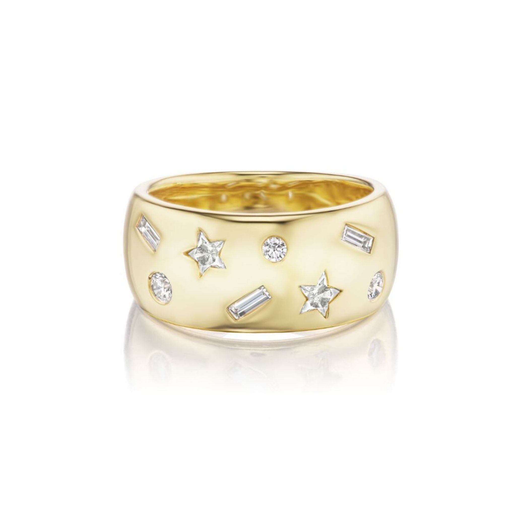 A wide gold ring featuring star-shaped and round diamonds, along with baguette-cut diamond accents, set in a scattered pattern on the band.