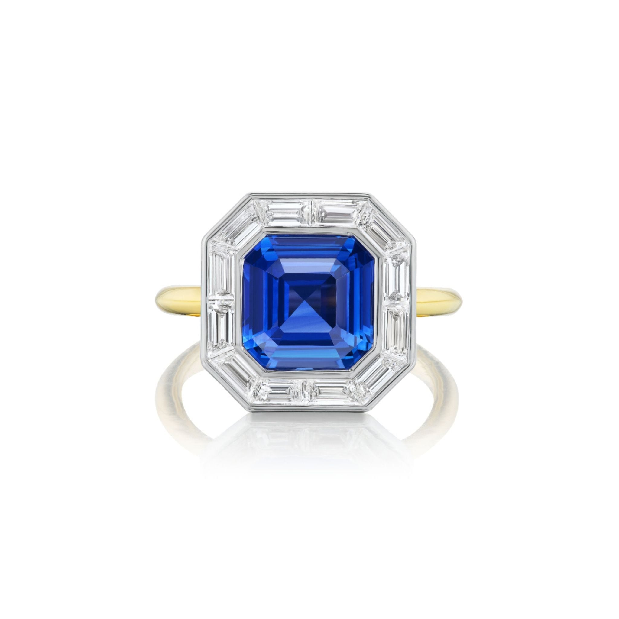 A gold ring with a large, square-cut blue gemstone at the center, surrounded by a border of baguette-cut clear stones set in a white metal.