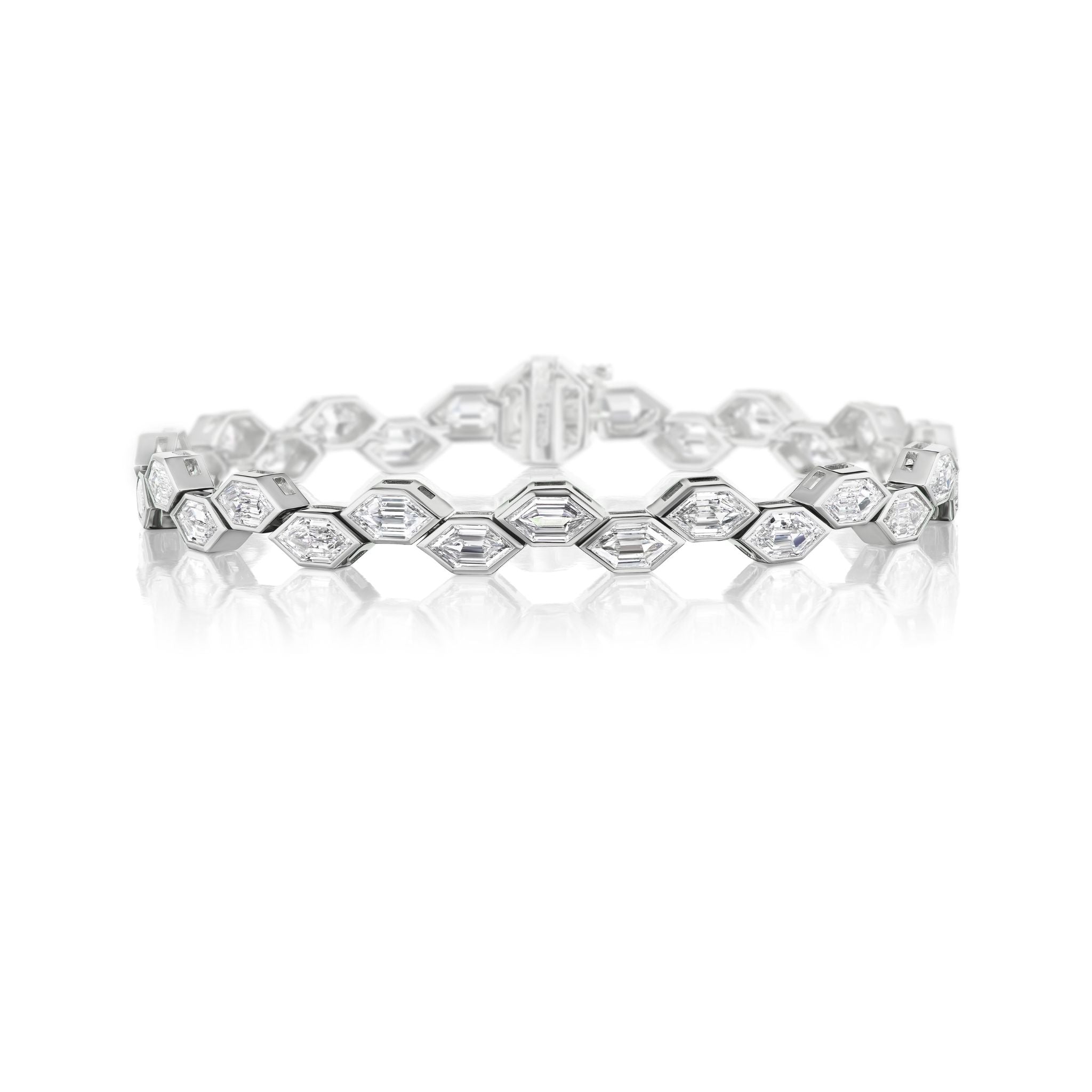 A silver tennis bracelet featuring a row of rectangular, sparkling white gemstones set in a continuous line, displayed on a white background.