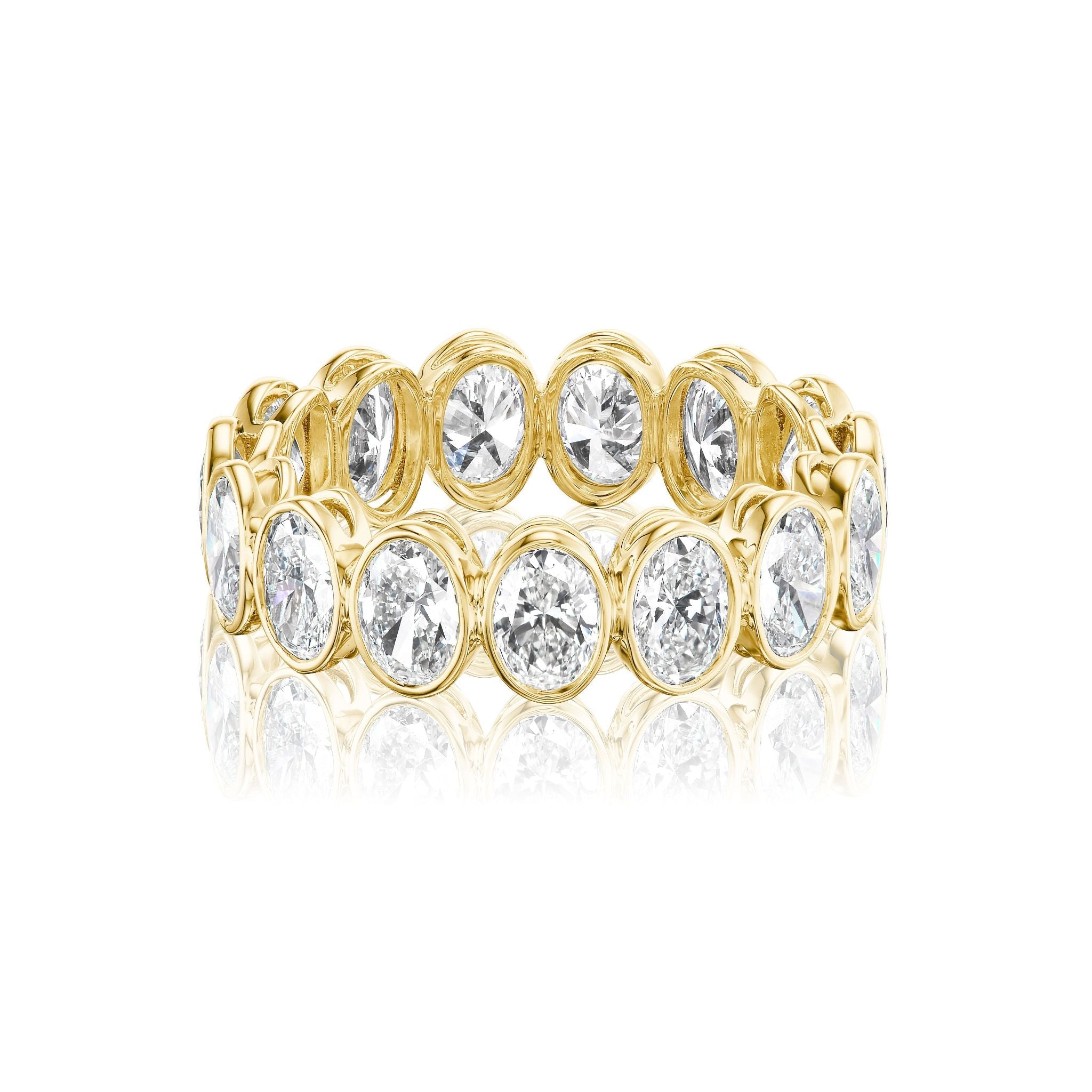 A white gold or platinum eternity band ring featuring a continuous row of large, round-cut diamonds set in a prong setting, displayed on a white background.