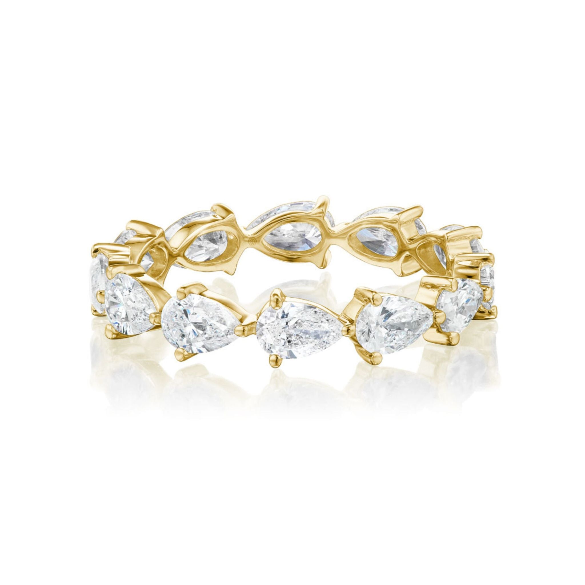 A white gold ring set with alternating pear-shaped blue sapphires and white diamonds in a row, forming a striking and elegant design.