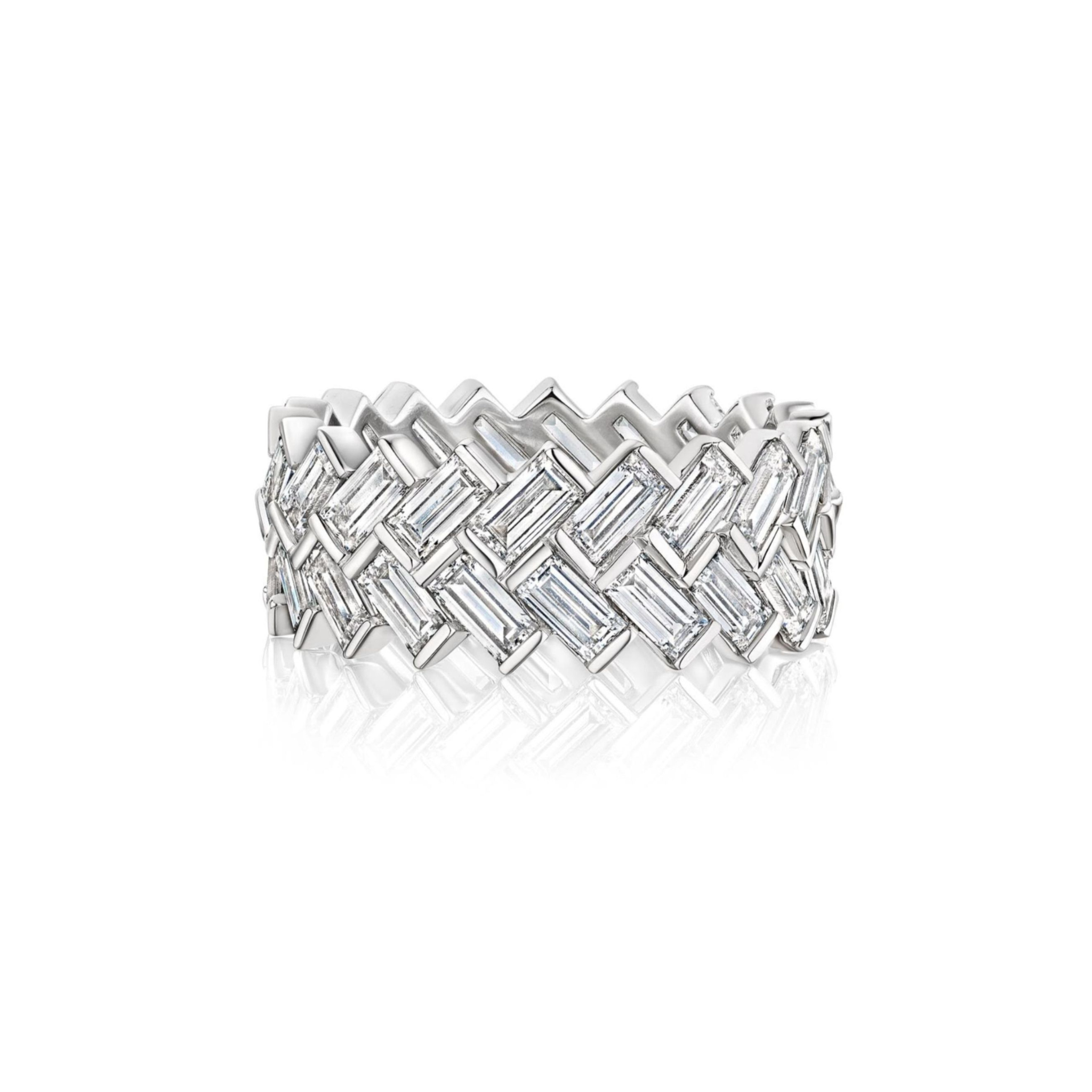 A silver eternity band ring featuring a continuous row of large, cushion-cut clear gemstones set closely together, displayed on a white background with a subtle reflection.