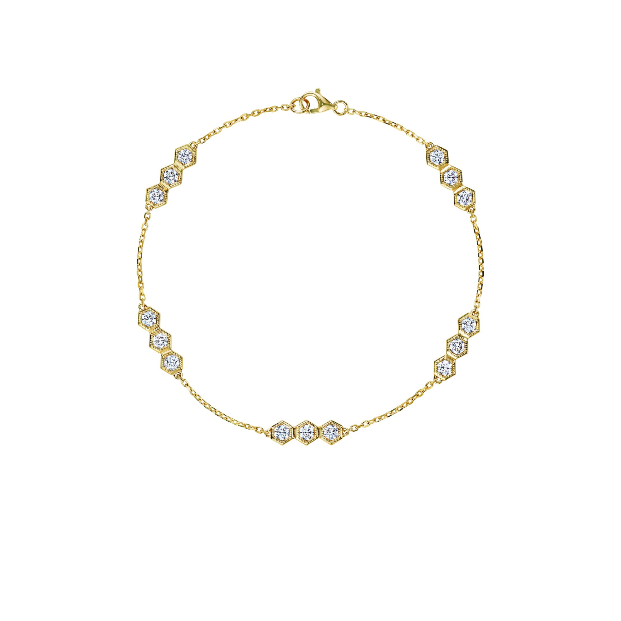 Delicate silver chain bracelet featuring five evenly spaced round white gemstones in bezel settings, each connected by fine chain links, with a small lobster clasp closure.
