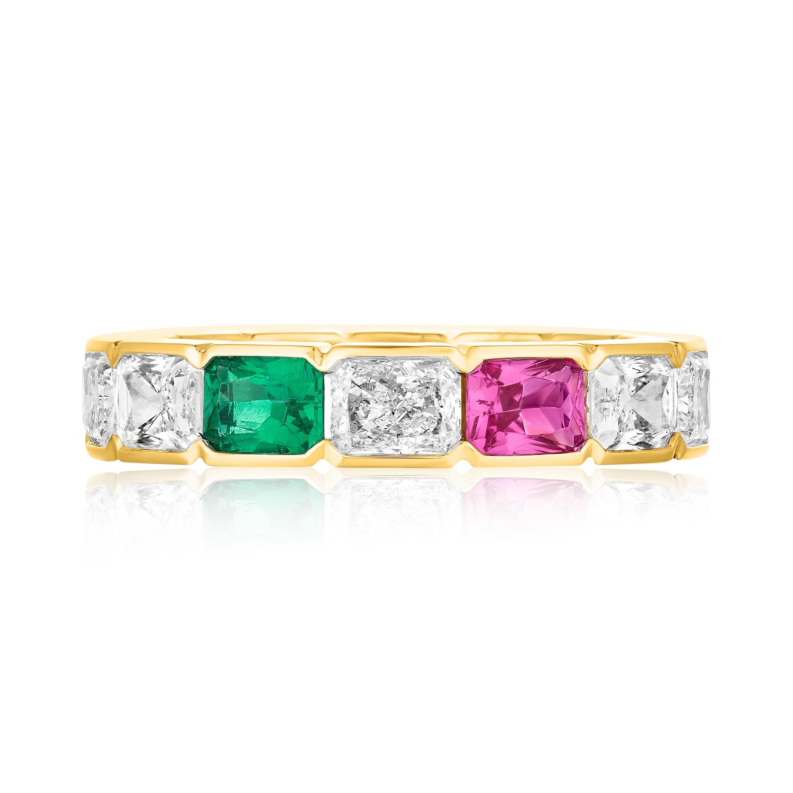 The East-West Half-Bezel Set Radiant Cut Diamond, Emerald, and Sapphire Eternity Band in Yellow Gold features alternating gemstones in 18K yellow gold, displayed against a white background.