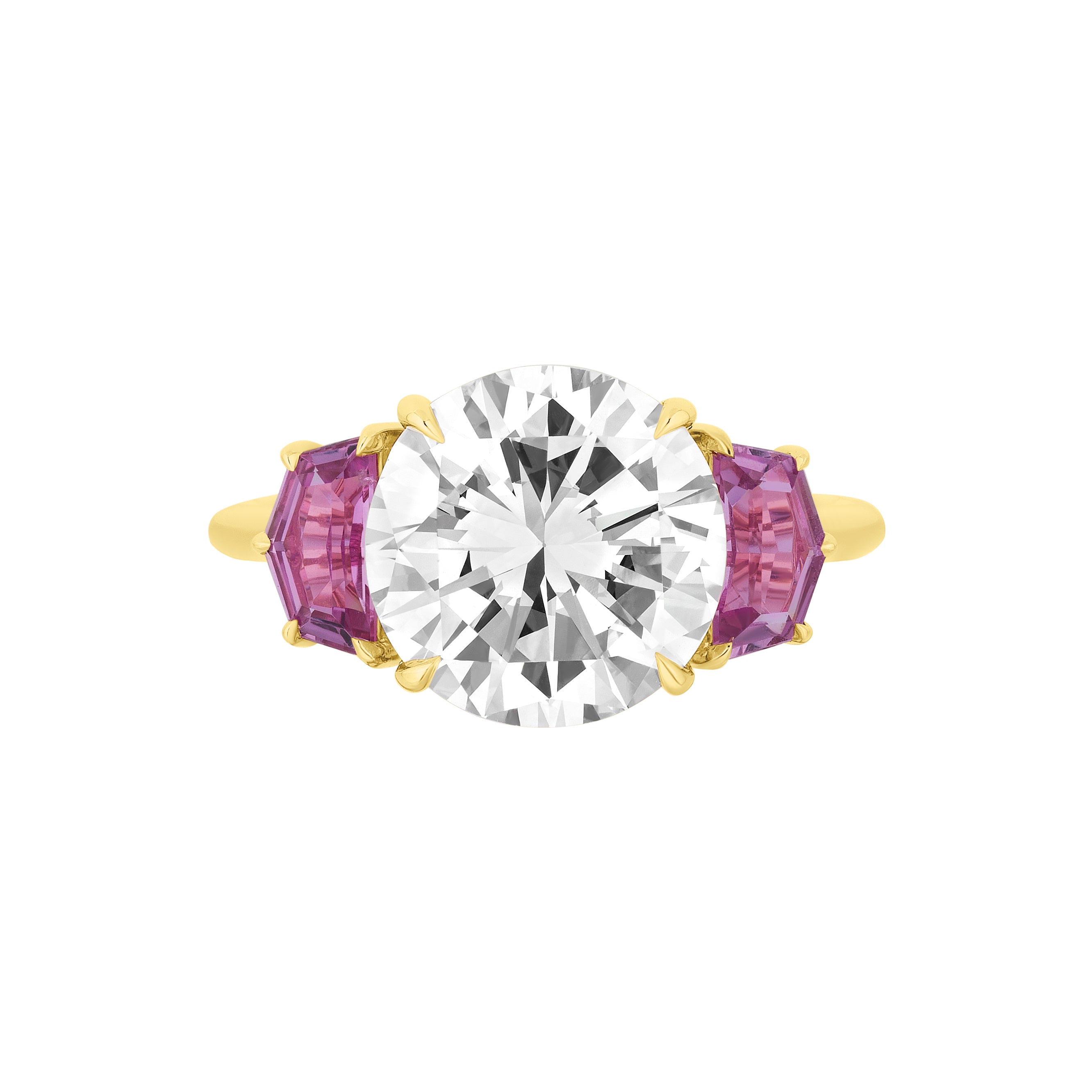 The Round Brilliant Diamond Engagement Ring features a central round diamond accented by two hexagon-shaped pink sapphire side stones.