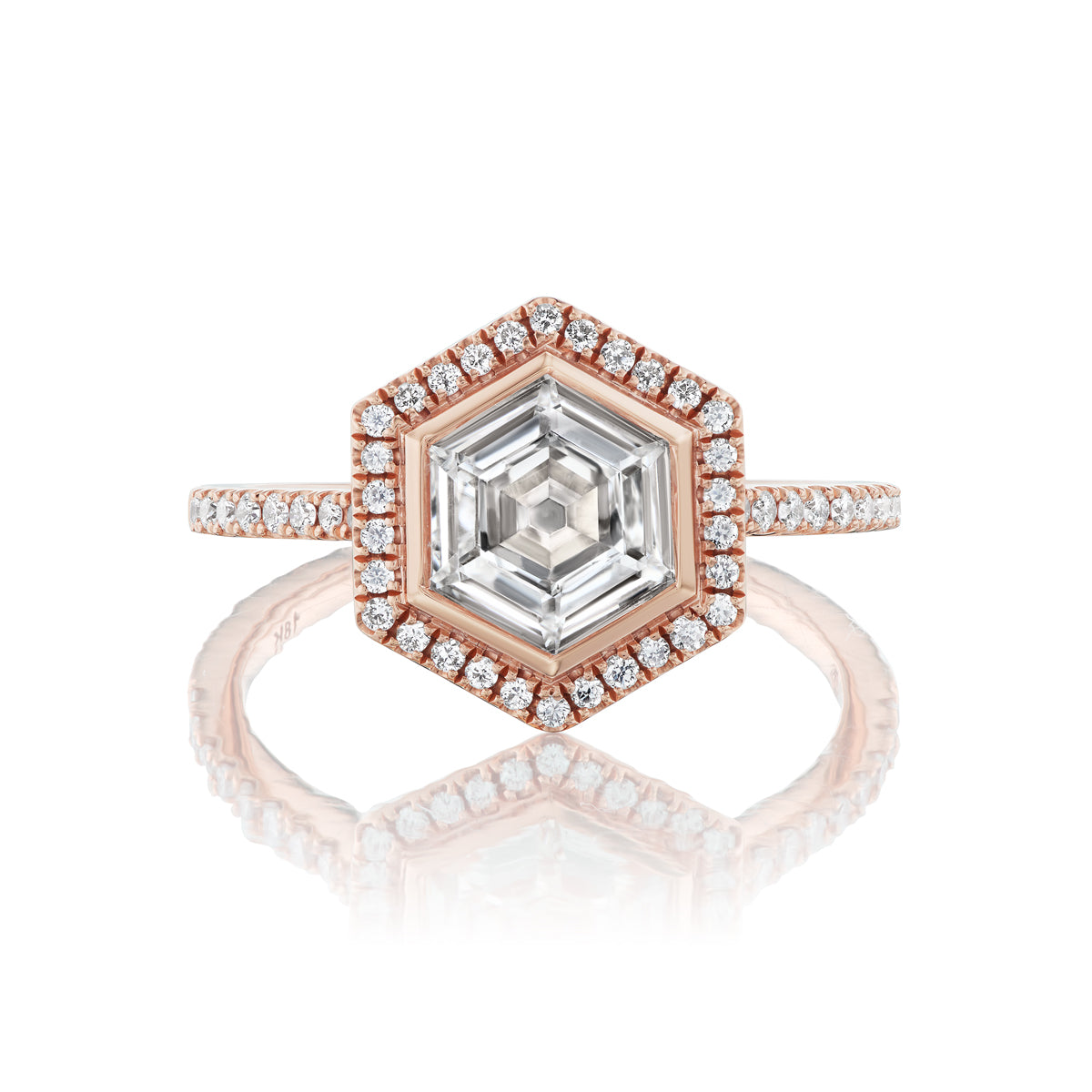 The Hexagonal Diamond Engagement Ring with Pavé Bezel and Band in 18k rose gold features a pavé bezel halo of diamonds and additional diamonds on the band for a dazzling look.