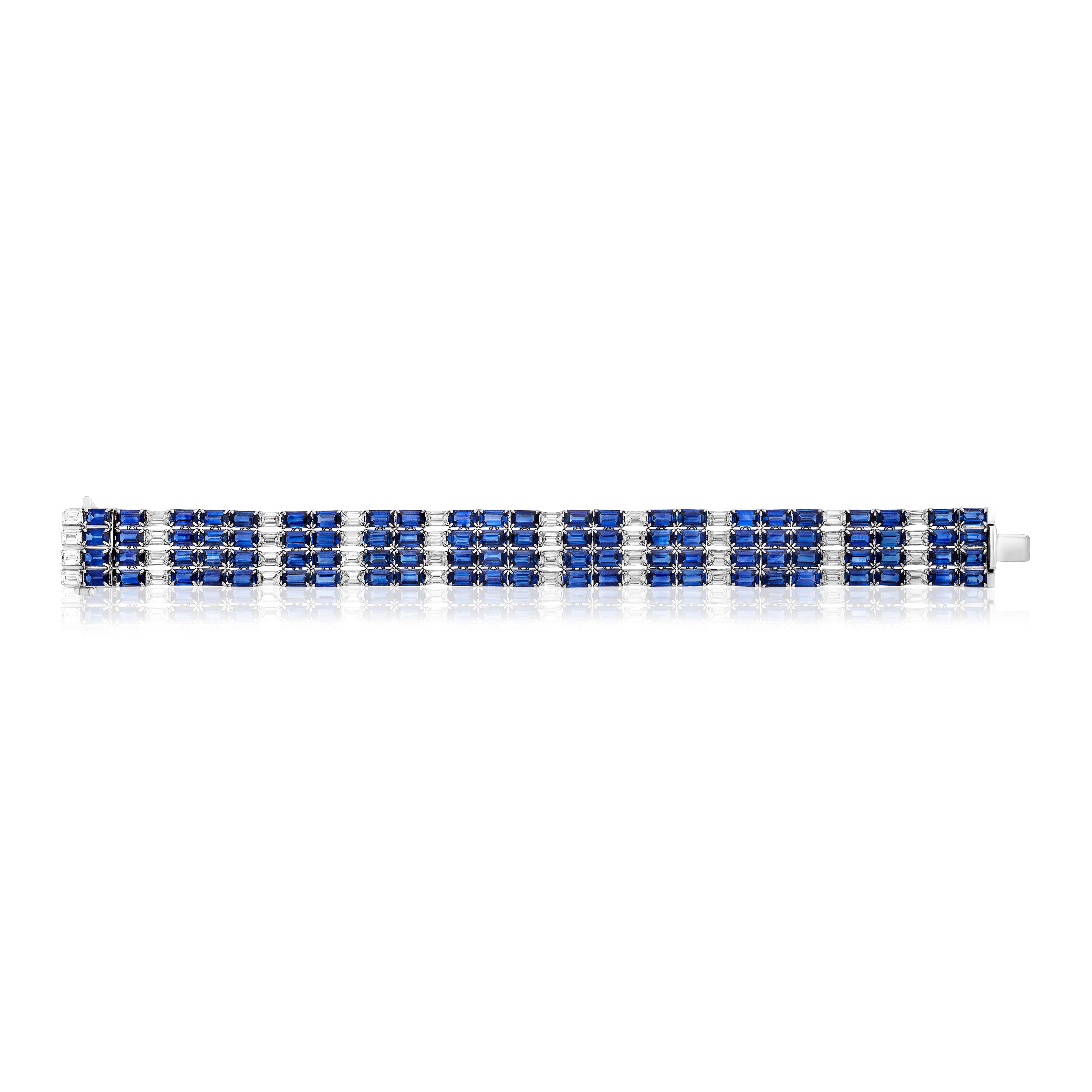 The Multi Strand Sapphire and Diamond Tennis Bracelet in White Gold features alternating rows of blue sapphires and sparkling diamonds set in a rectangular, grid-like white gold design.