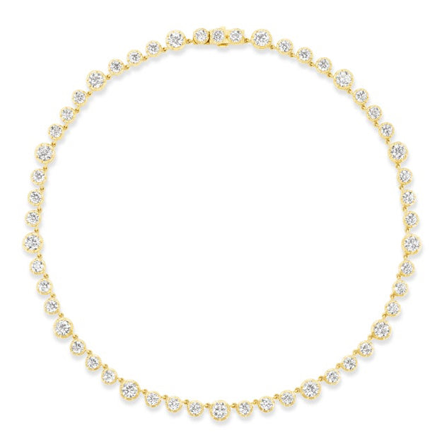 The Collet Set Round Diamond Graduated Tennis Necklace in Yellow Gold features a row of round diamonds, each set in a gold bezel, creating an elegant and timeless circle.