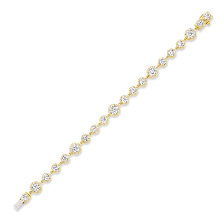 The Collet Set Round Diamond Graduated Tennis Bracelet in Yellow Gold showcases a single row of round diamonds in gold bezels, elegantly aligned on a white background.