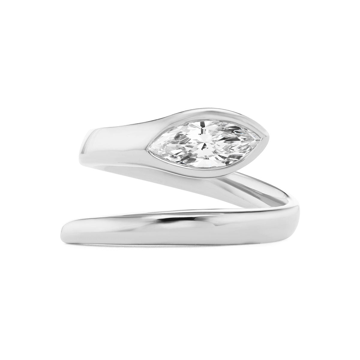 The Serpent Wraparound Ring features a modern open-ended design with a marquise diamond set at one end.