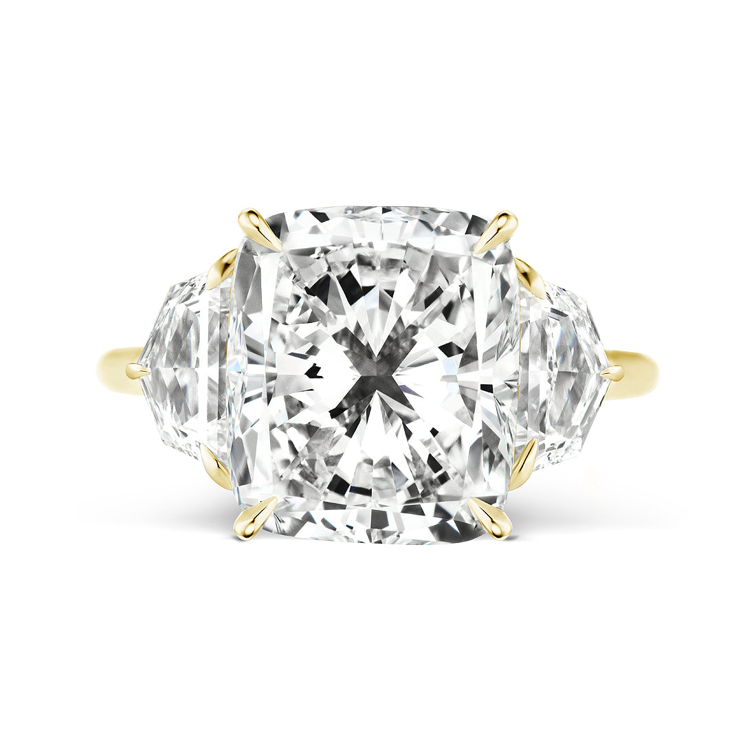 The Cushion Cut Diamond Engagement Ring features a cushion-cut center diamond with epaulette side stones, all set in yellow gold prongs.