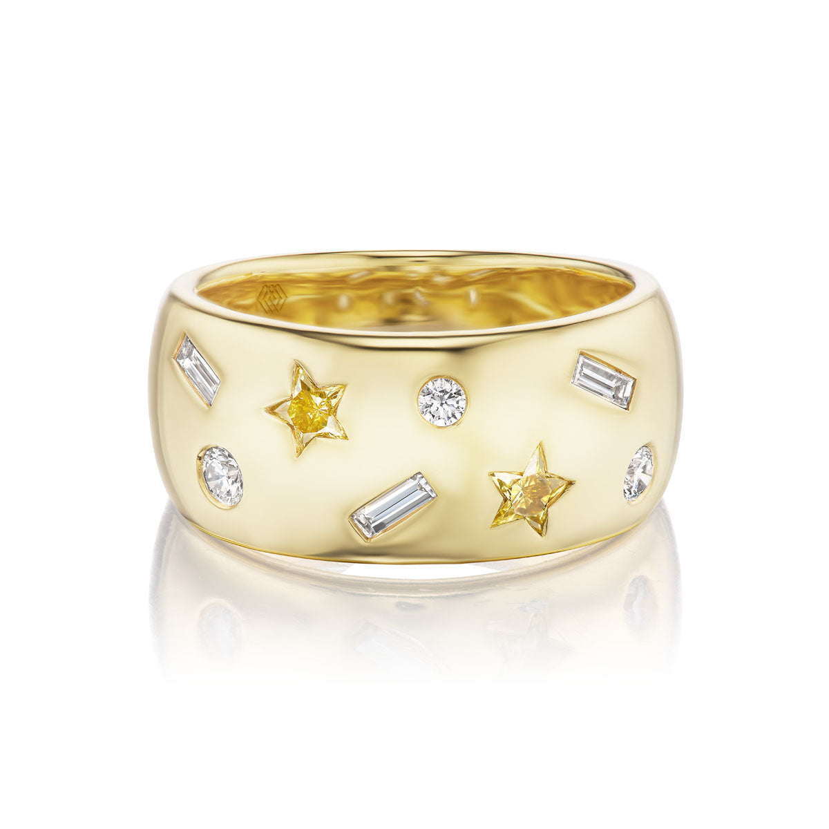 The Yellow Diamond Celestial Cigar Band is an 18k yellow gold band set with yellow star diamonds, round white diamonds, and rectangular baguette diamonds against a white background.