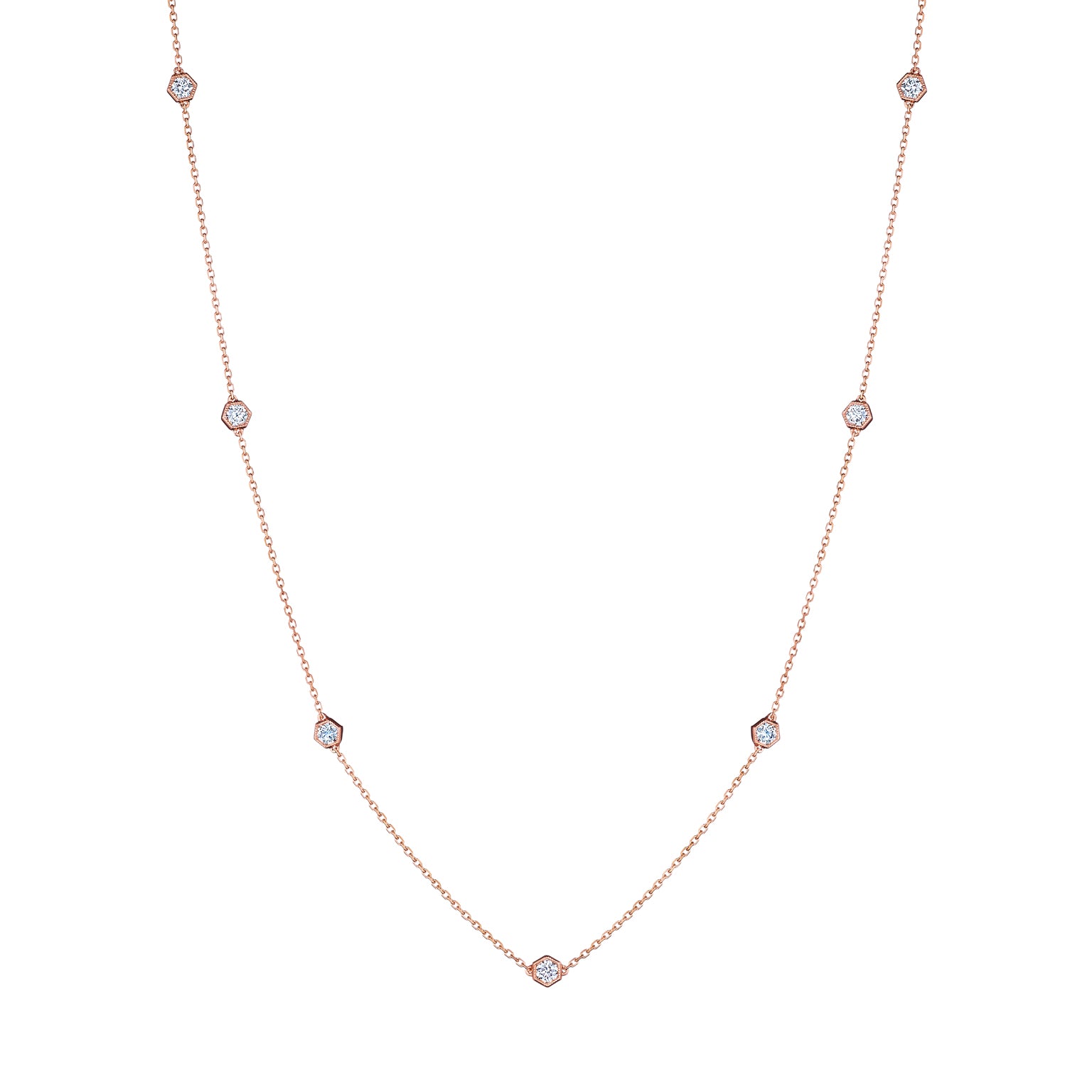 A striking Large Serpentine Station Necklace featuring hexagon bezel set diamonds elegantly spaced along the chain.