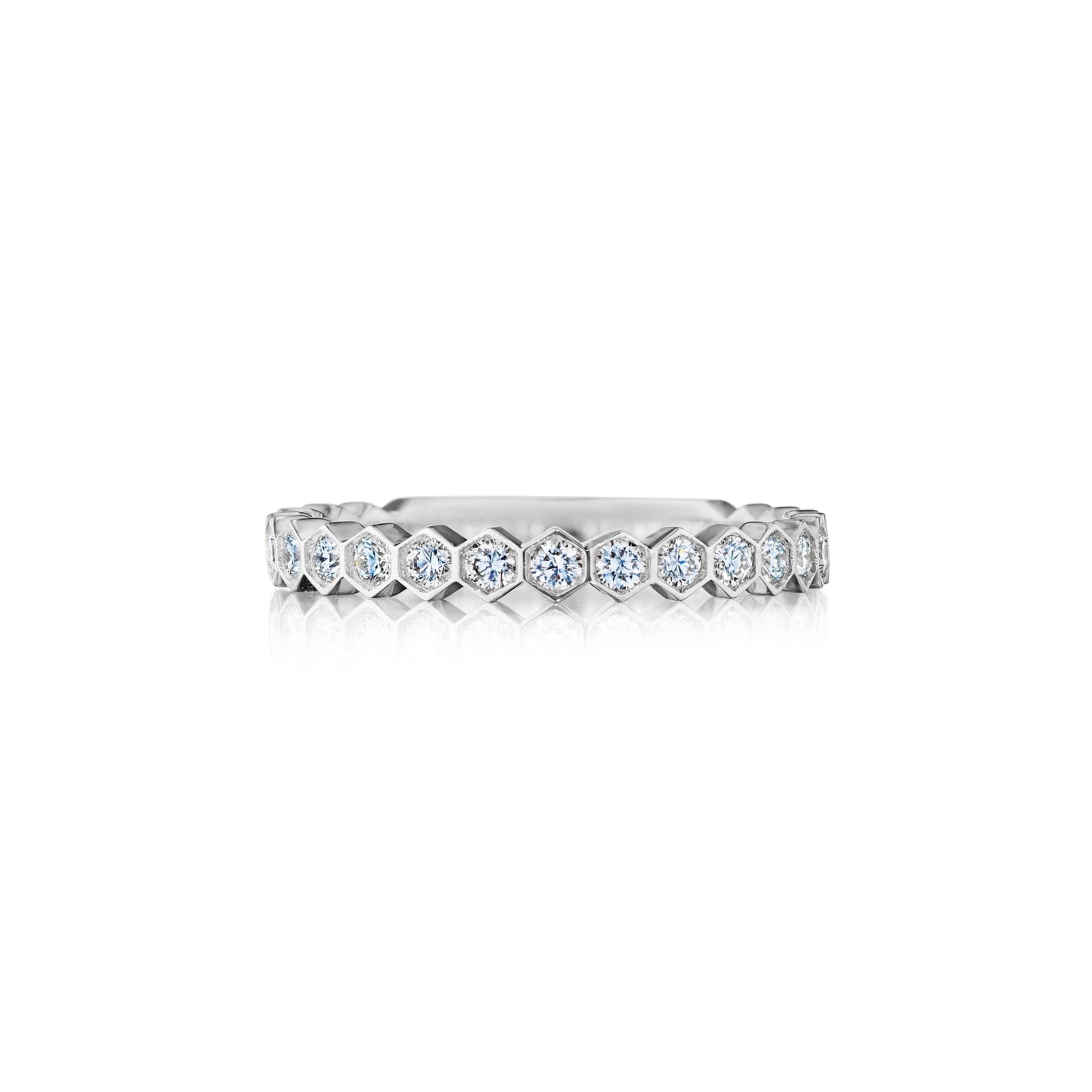 The Hexagon Bezel Set Diamond Band in 18k gold features a continuous row of round diamonds encircling the band, shown on a white background.
