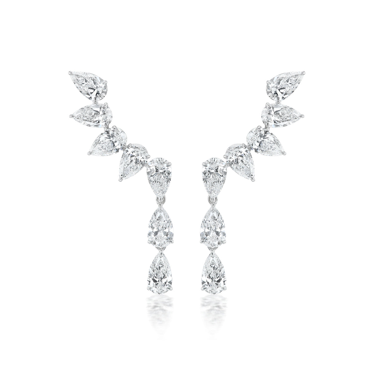 The Crescent Waterfall Earrings in White Gold feature multiple pear diamonds of VS1 clarity in a cascading, symmetrical design, set in luminous 18K white gold against a white background.