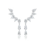 The Crescent Waterfall Earrings in White Gold feature multiple pear diamonds of VS1 clarity in a cascading, symmetrical design, set in luminous 18K white gold against a white background.