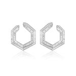 The Chrysler Front-To-Back Hoops with Baguette Diamonds are geometric hexagonal silver earrings, each edge set with small rectangular diamonds, shown on a white background.