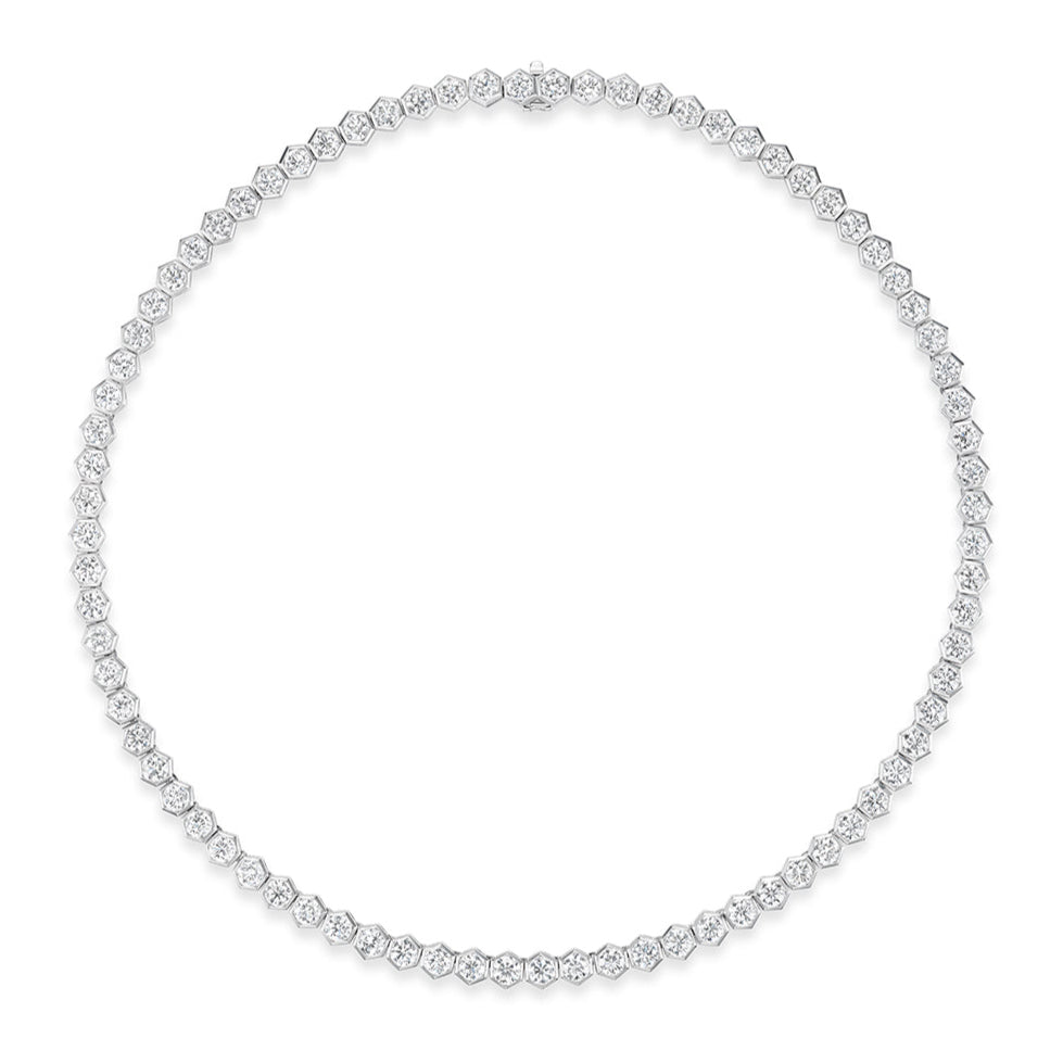 The Large Hexagon Bezel Set Diamond Tennis Necklace in White Gold features bezel-set diamonds in a complete circle, showcased against a white background.