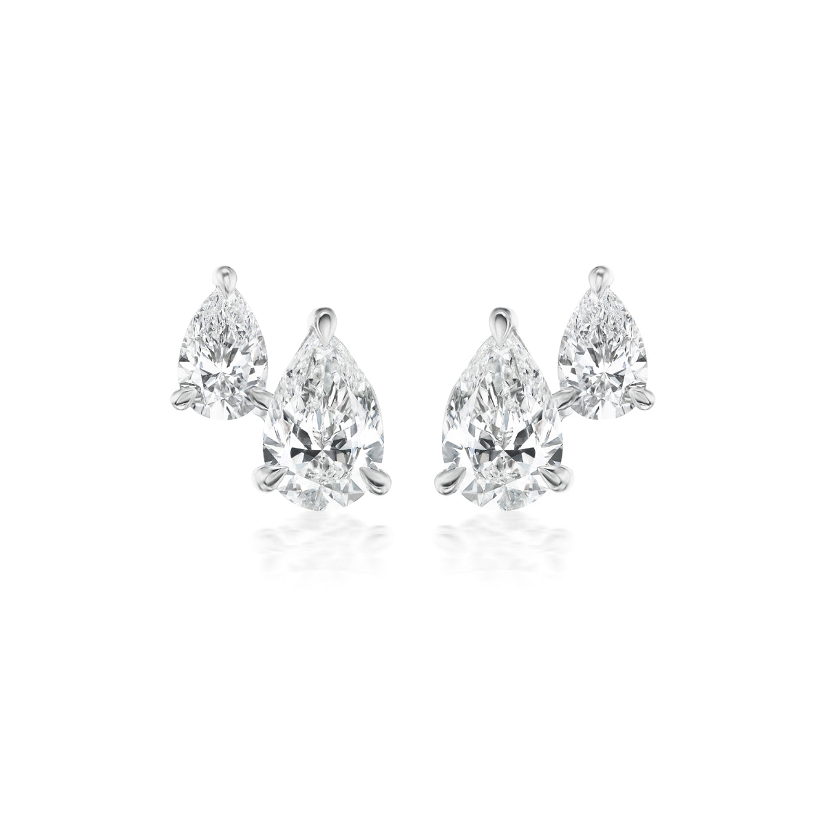 The Duo Studs in White Gold with Pear Diamonds feature two pear-shaped clear diamonds set in 18K white gold, elegantly displayed on a white background.