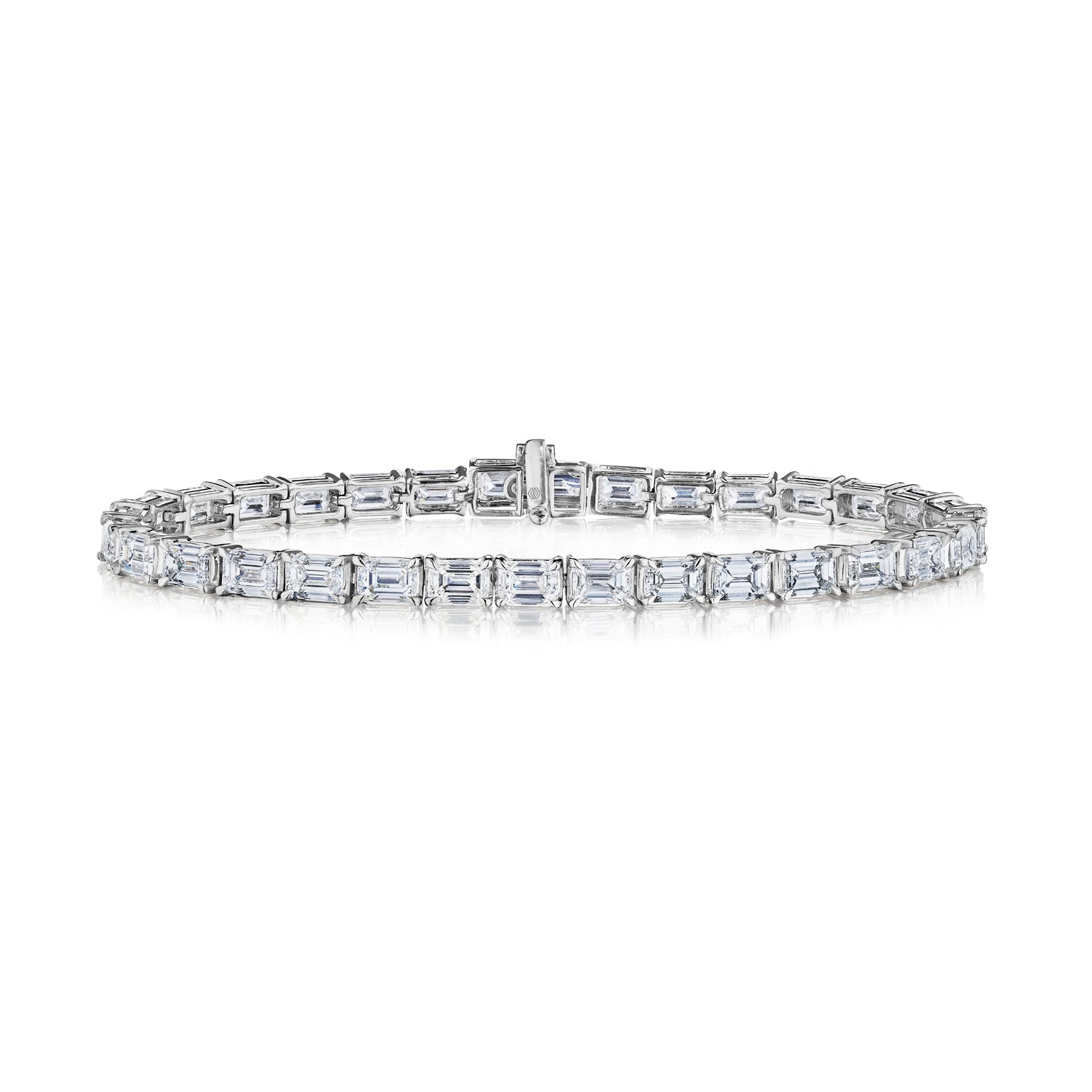 The Large East-West Emerald Cut Diamond Tennis Bracelet in White Gold features a continuous row of VS clarity diamonds set in 18K white gold, shown against a white background.