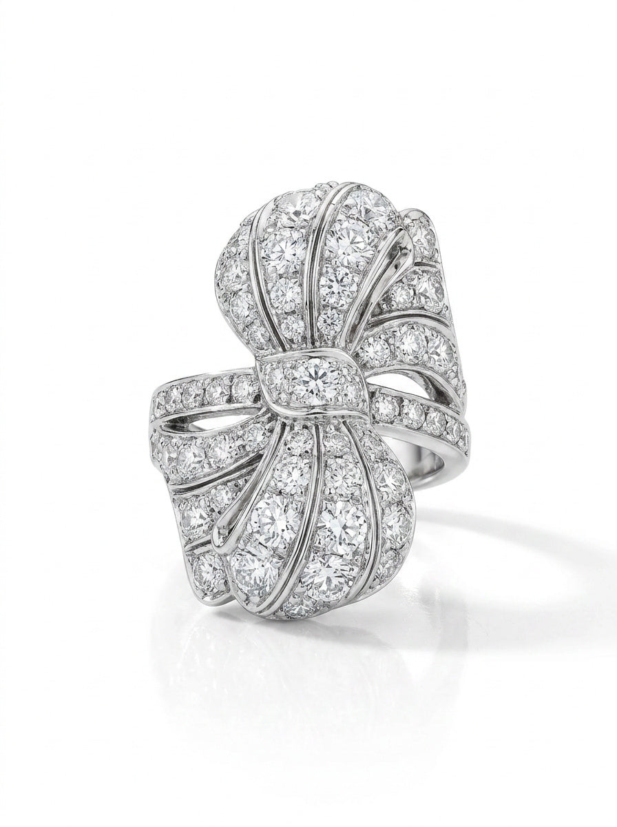 The Diamond Ring features old European diamonds set in platinum, inspired by 1930s jewelry, with elegant curved lines and intricate detailing.
