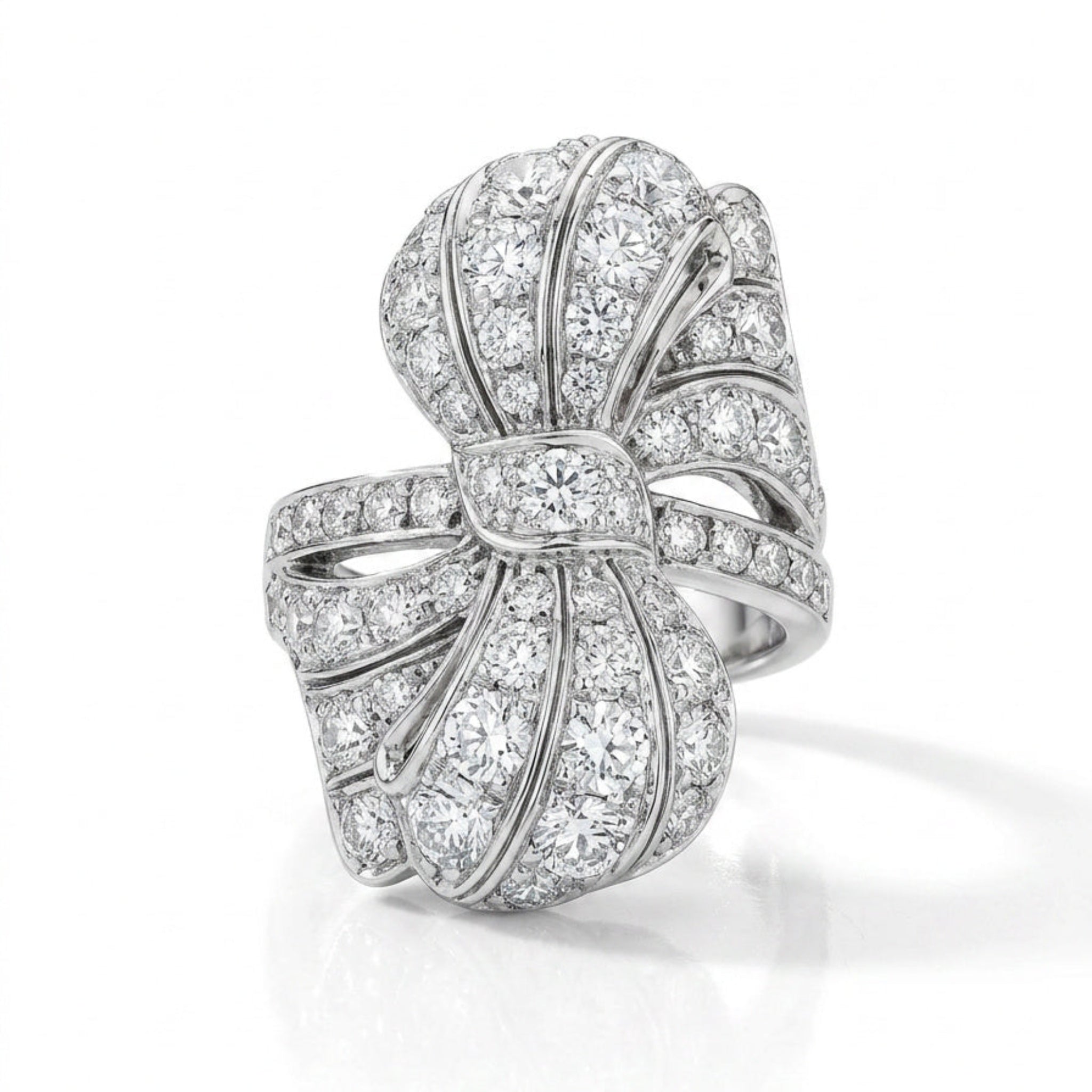 The Diamond Ring features old European diamonds set in platinum, inspired by 1930s jewelry, with elegant curved lines and intricate detailing.