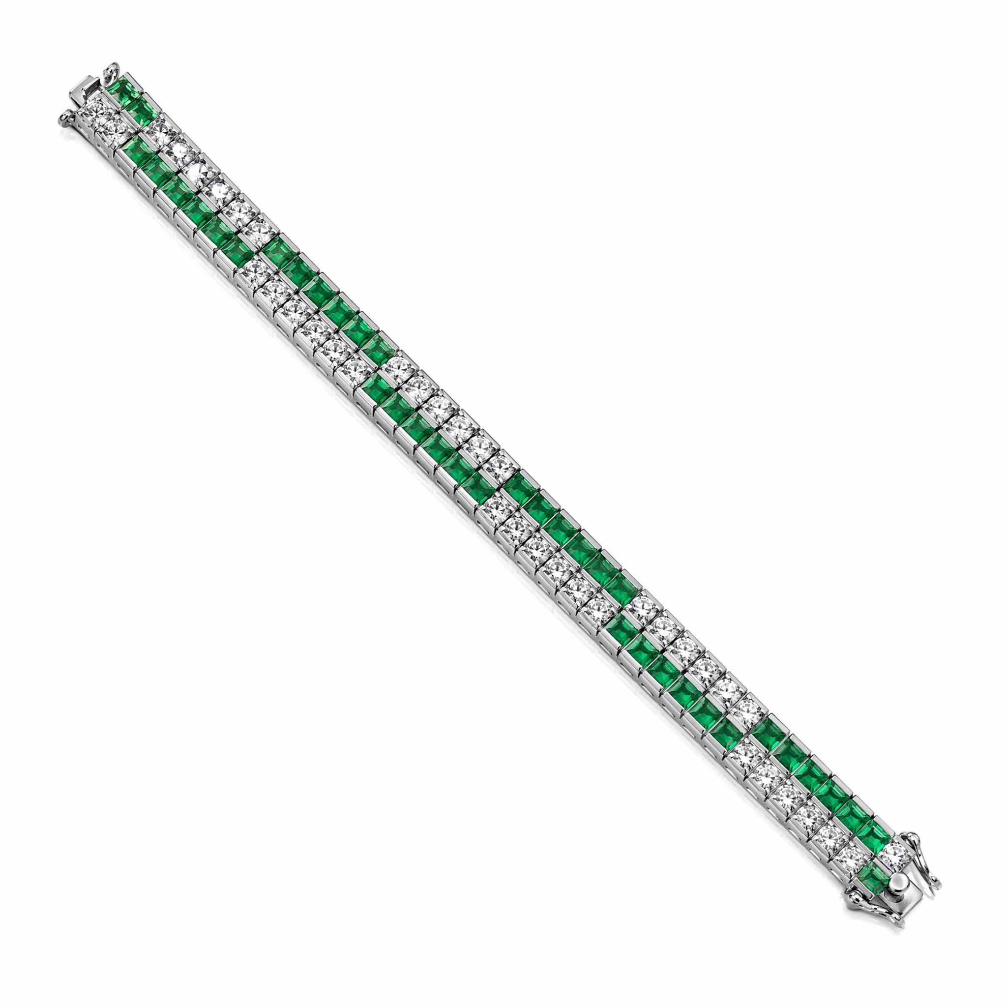 The Emerald and Diamond Bracelet features alternating square-cut green emeralds and round white diamonds set in two parallel rows, displayed on a white background.