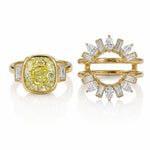 The Bezel Set Cushion Cut Yellow Diamond Ring Jacket features a cushion cut yellow diamond accented by pear and emerald cut side stones for a striking, elegant look.