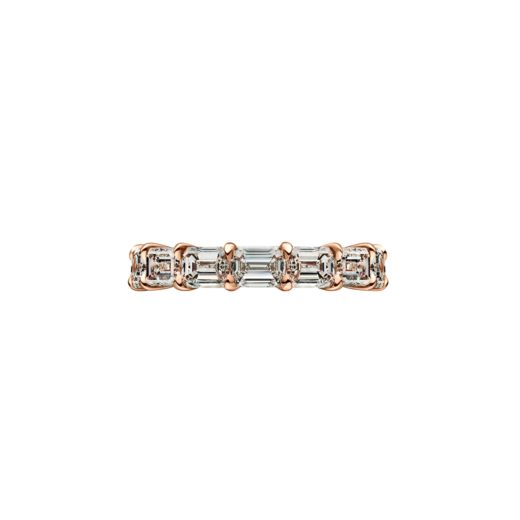 The East-West Emerald Cut Diamond Eternity Band features rectangular baguette and emerald cut VVS1 clarity diamonds in white metal with rose gold prongs, elegantly displayed on a white background.