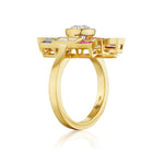 Introducing the Art Deco Bezel Set Ring in Yellow Gold, showcasing a bold geometric design adorned with multicolor baguette cut sapphires and diamonds encircling the band, and crowned with a prominent round gemstone on top.