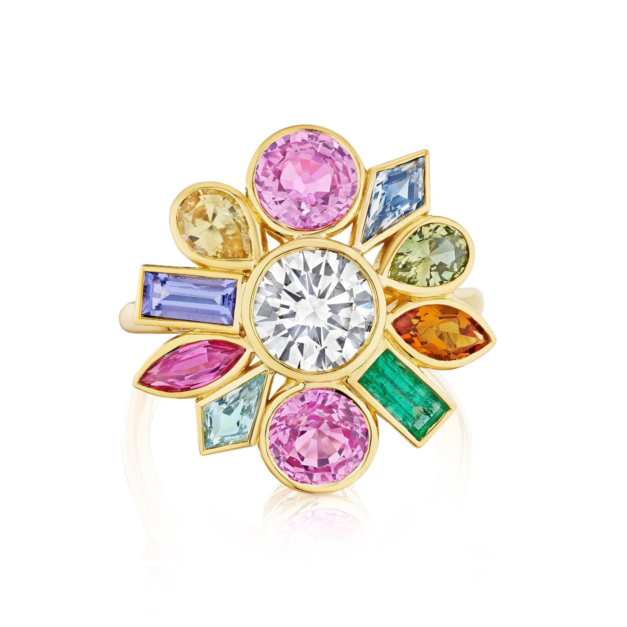 The Bezel Set Round Brilliant Diamond and Sapphire Multi Color Ring in Yellow Gold showcases a central round brilliant diamond accented by sapphires in an array of colors—pink, yellow, blue, green, and orange—artfully arranged in a floral-inspired design.