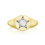 America250 Star Signet Ring in Yellow Gold and Platinum, handcrafted in New York City, showcases a round white stone set at the center of a star motif, accented with small clear stones on a smooth, polished band—a standout piece from the America250 capsule collection.