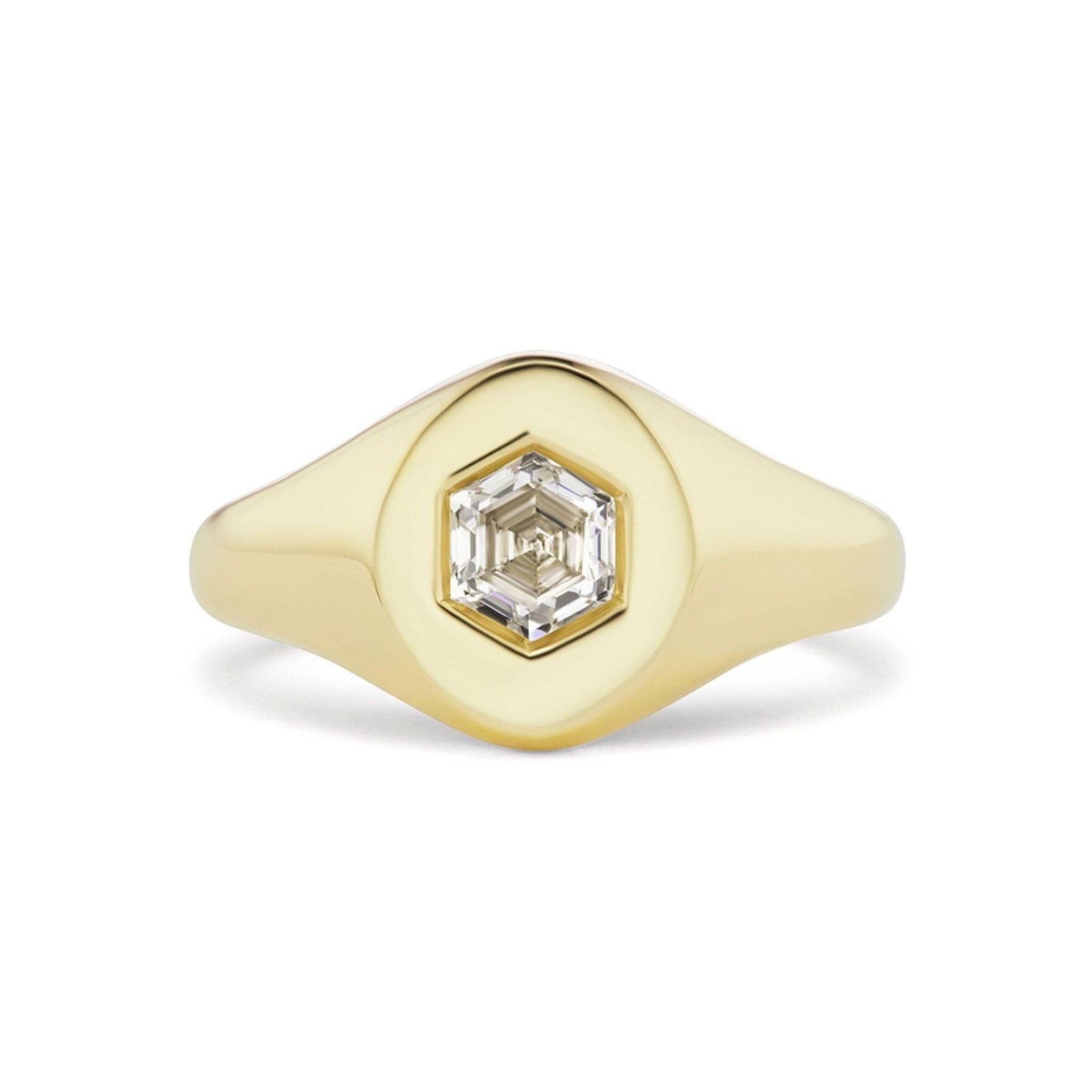 Introducing the Signet Ring with Burnish Set Hexagon Diamond—a striking 18k gold ring showcasing a flat, wide band and a brilliant hexagon-cut diamond elegantly burnish set at its center.