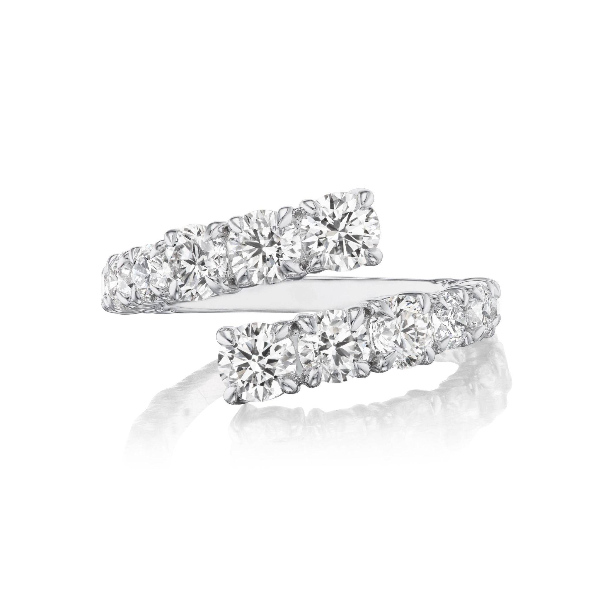A Graduated Round Diamond Wraparound Ring in white gold, featuring two rows of round diamonds set in 18k white gold and displayed on a white reflective surface. Available in size 6.