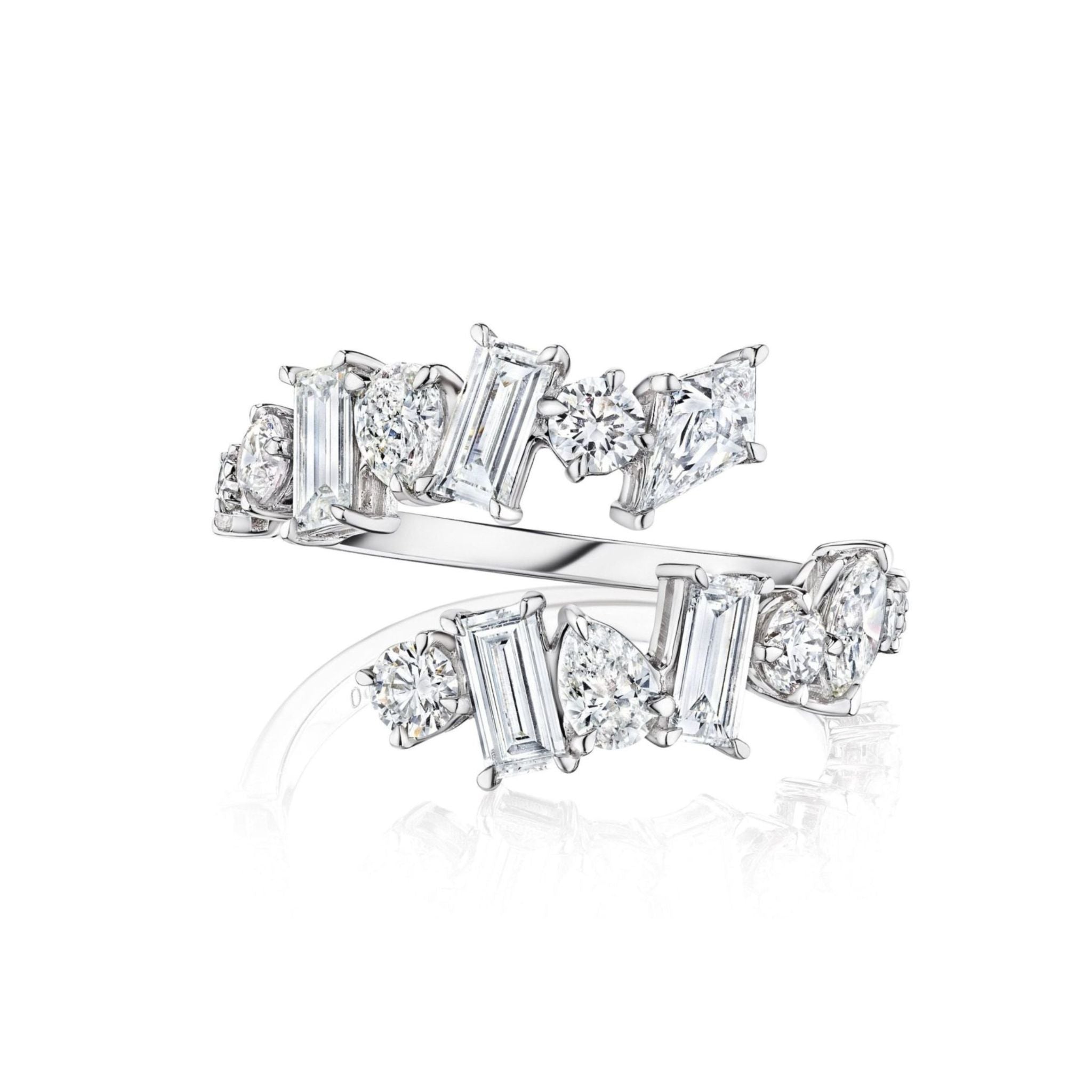 The Mixed Shape Kite Diamond Wraparound Ring in White Gold features alternating round and rectangular-cut clear gemstones, including dazzling baguette diamonds, set in a modern open-band design, displayed on a white background.