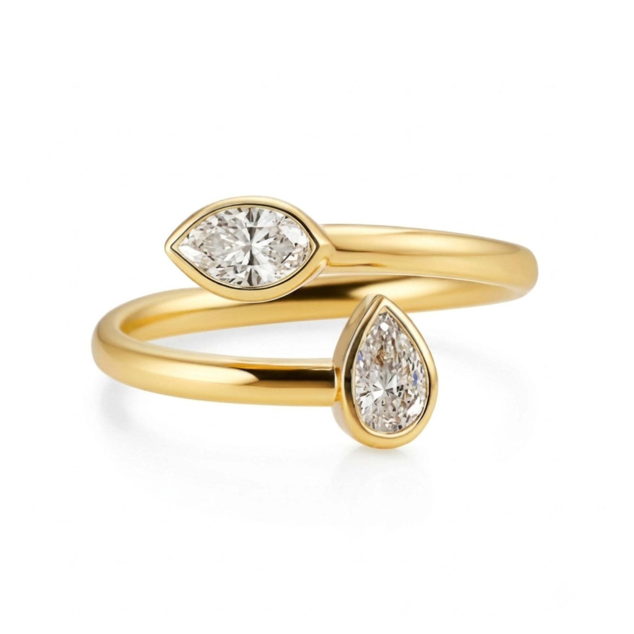 Sure! Here’s a revised sentence using your product data: The Toi et Moi Bezel Set Marquise and Pear Shape Diamond Wraparound Ring in yellow gold features a pear-shaped diamond and a marquise diamond at each end, elegantly set against a white background.