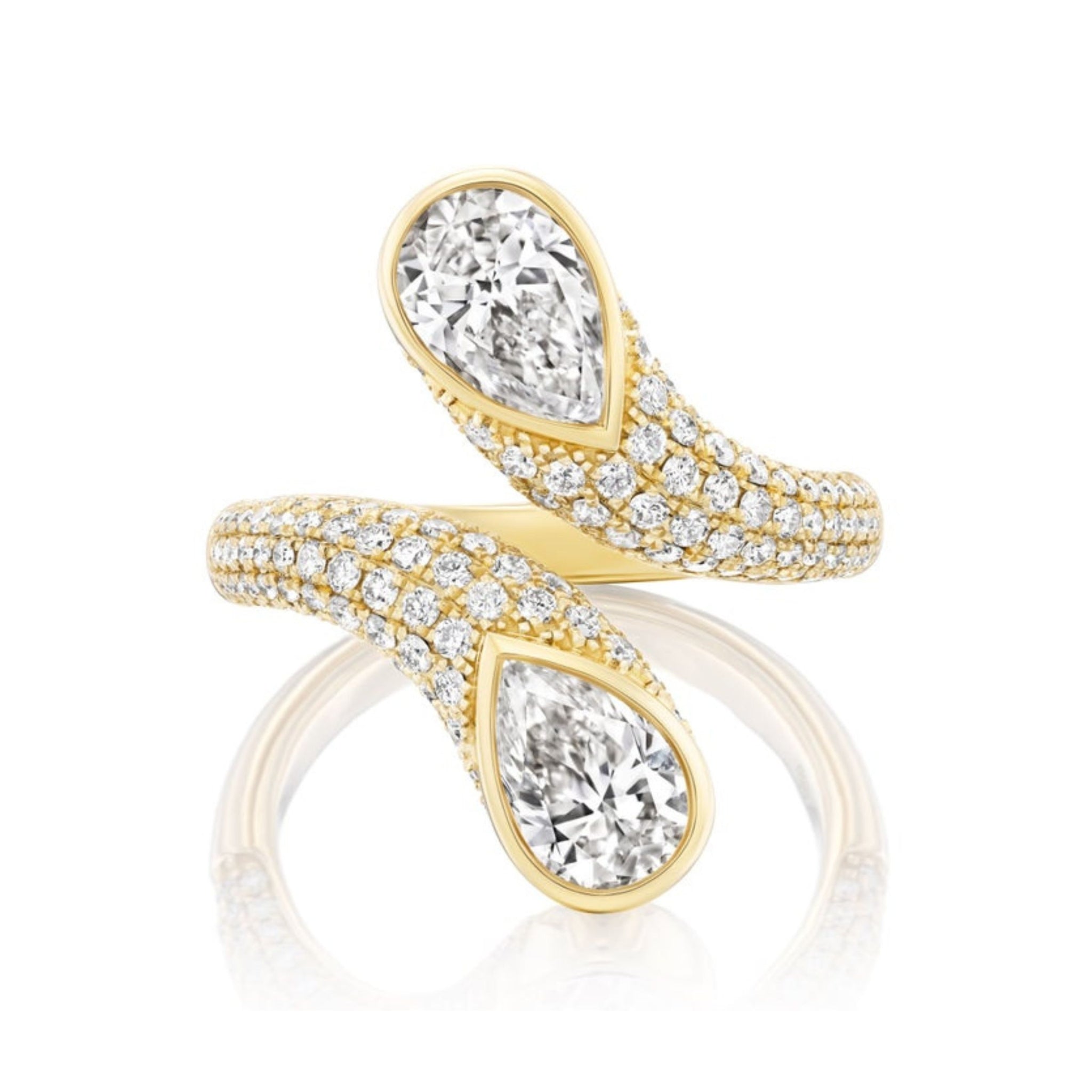 The Snake Open Space Ring in Yellow Gold with Two Pear Shape Diamonds features an elegant bypass design, reminiscent of a serpent, with two pear-shaped diamonds at each end and smaller diamonds encrusted along the 18k yellow gold band for a sparkling finish.