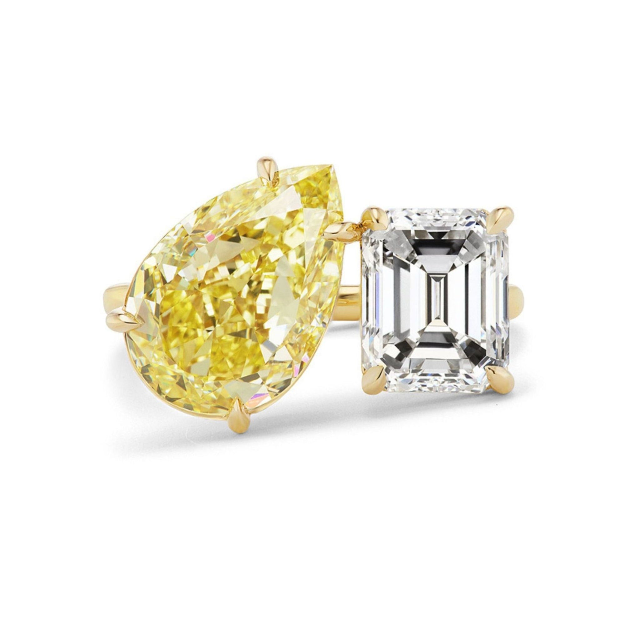 Introducing the Toi et Moi Ring, featuring a fancy yellow pear-shaped diamond paired with a white emerald cut diamond side by side.