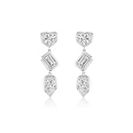 The Bezel Set Mixed Shape Diamond Drop Earrings feature three diamonds per earring—a heart-shaped top, a baguette-cut center, and a teardrop bottom—all set in silver.