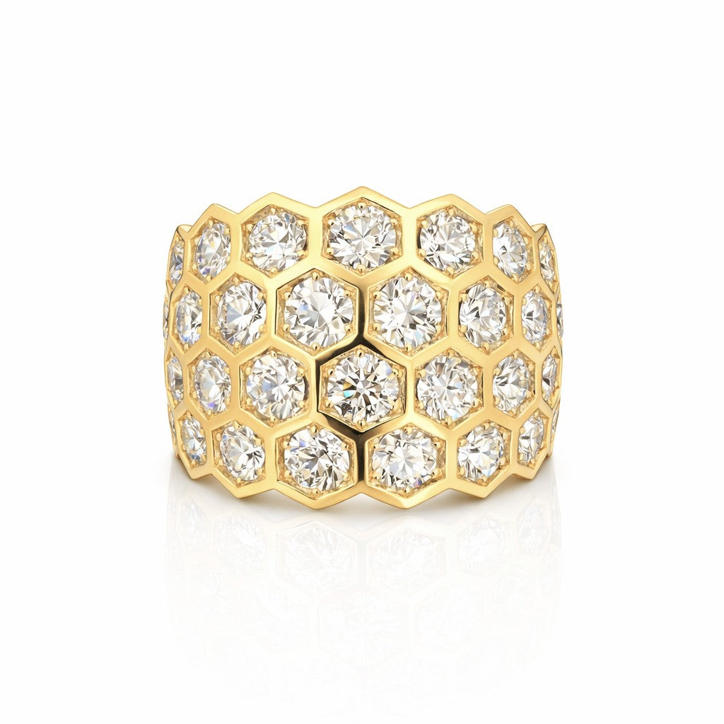 The Hexagon Bezel Set Multi-Tier Chunky Band showcases round diamonds in each hexagonal bezel on wide 18k yellow gold, offering a sparkling, luxurious honeycomb-inspired design.