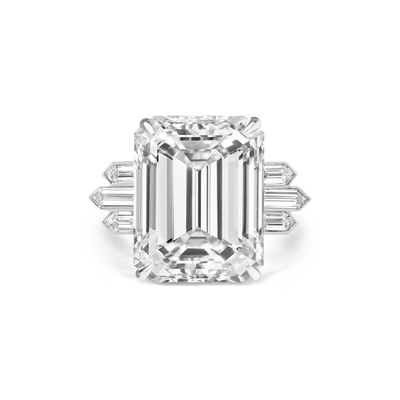 An Art Deco large emerald-cut diamond engagement ring featuring bezel-set bullet diamond side stones on a platinum band.
