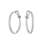 Bezel Set Hexagon Hoops with Round Brilliant Diamonds, featuring sparkling diamonds along the front edge, shown on a white background.
