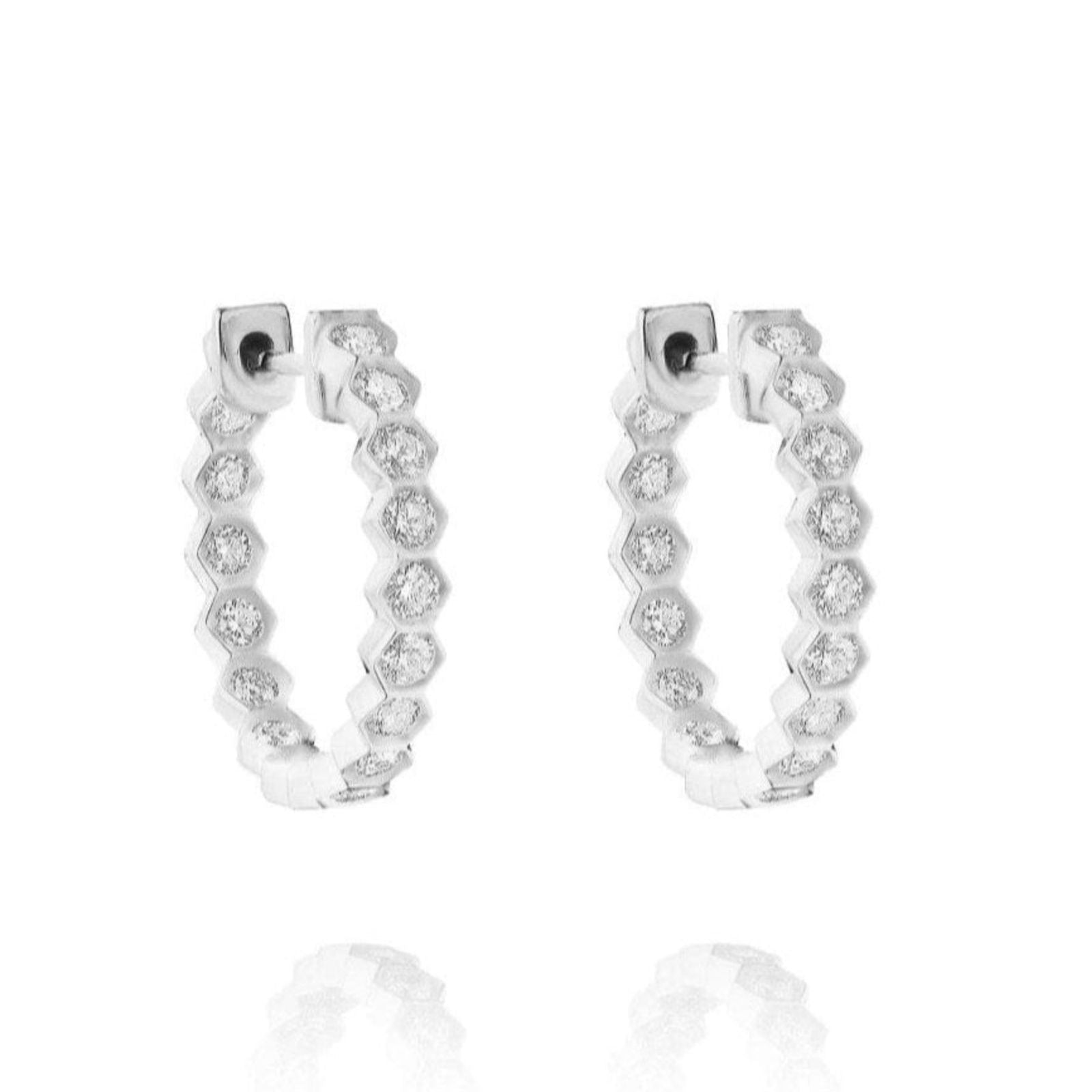 Bezel Set Hexagon Huggies with Round Brilliant Diamonds feature a geometric hexagonal design, each segment adorned with a sparkling round diamond, beautifully displayed on a white background.